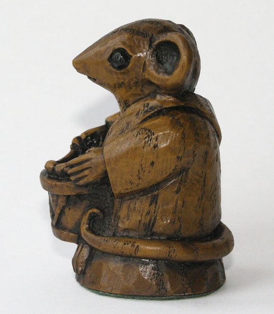 Wooden mouse figurine with a drum, side view