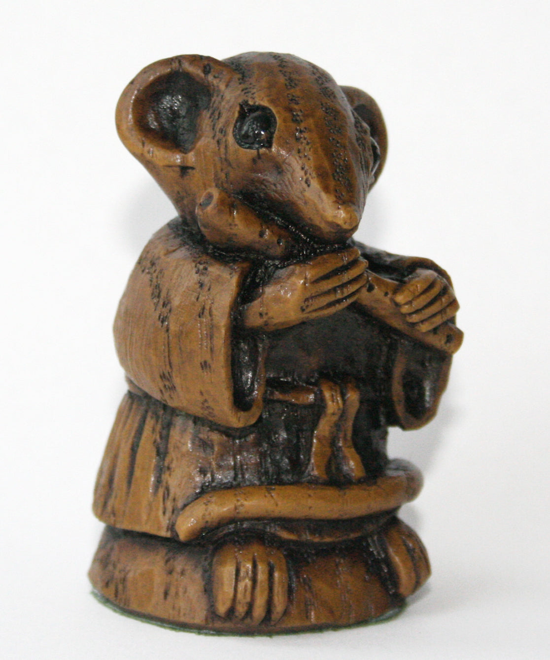 mouse figurine playing a flute side 