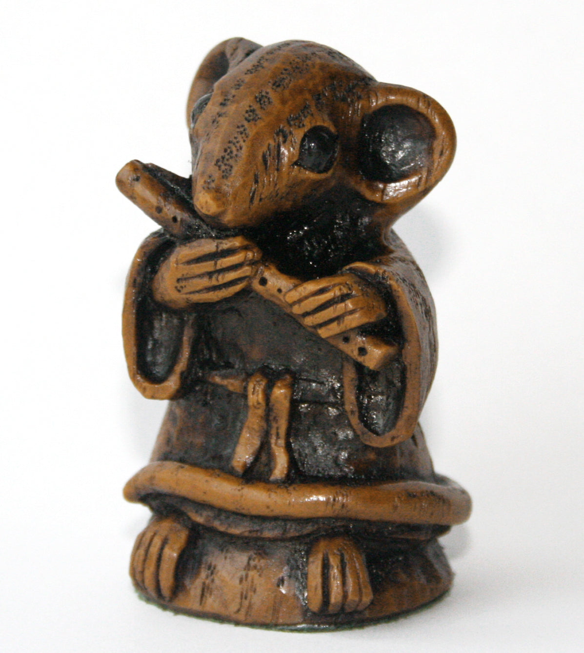 mouse figurine playing a flute side view