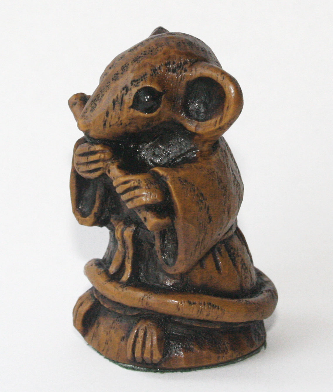 mouse figurine playing a flute left side 