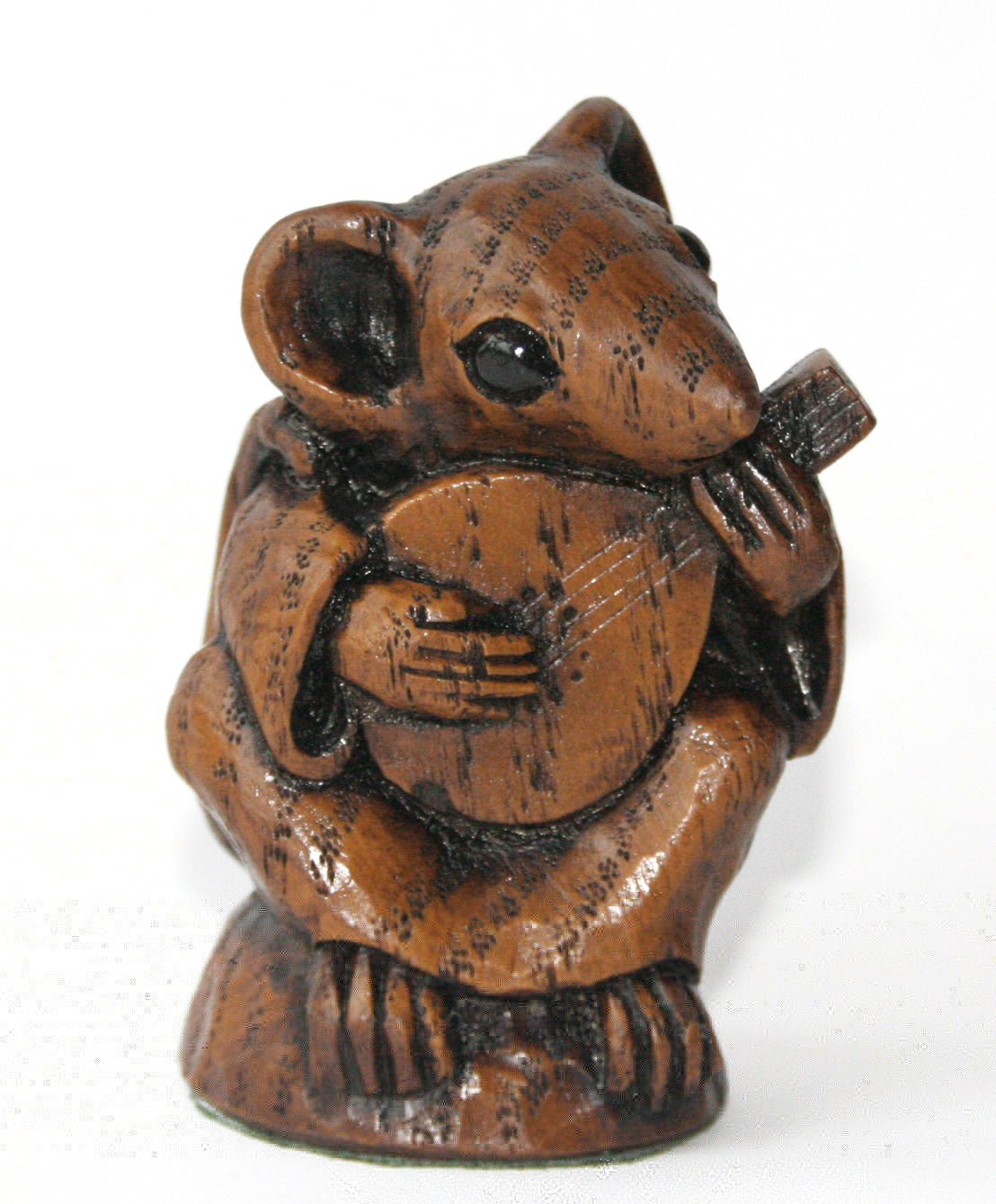 Wooden figurine of a mouse playing a mandolin 