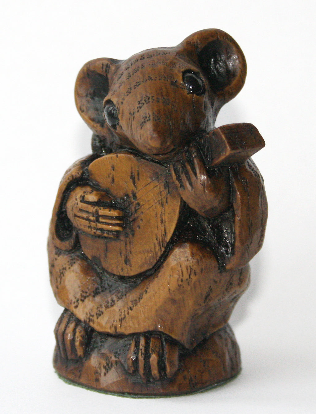 Wooden figurine of a mouse playing a mandolin front view